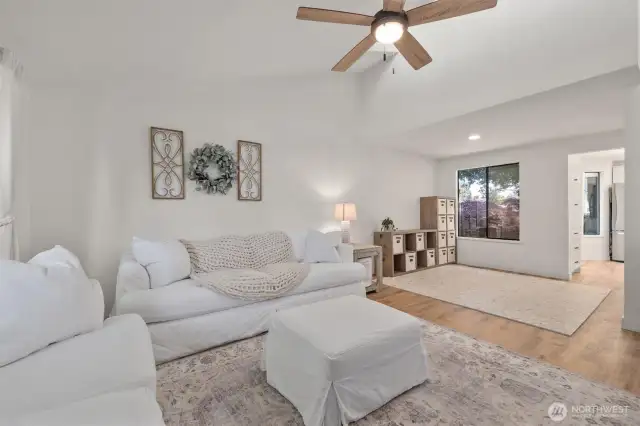 Living room leading to the dining room (currently a play area or extra flex space)