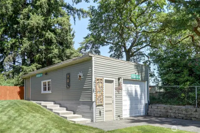 Detached garage  16x22 and 5x16 shop area. Lots of storage! Garage is lined with shelving