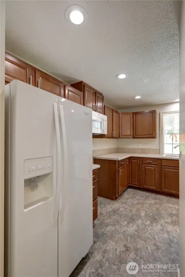 Refrigerator stays - new stove coming soon