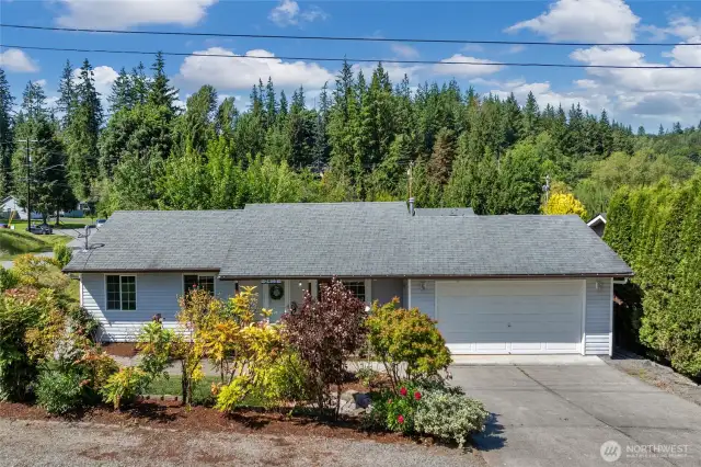 Front of house with additional parking