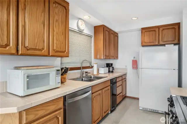 Sink has instant hot water and garbage disposal.