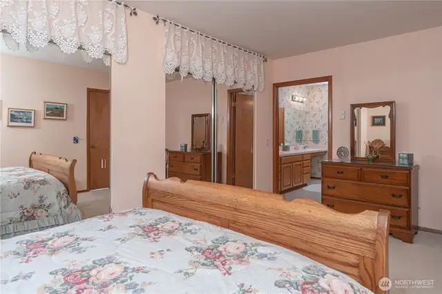 Main floor bedroom offers large double closets and convenient access to a Jack and Jill bathroom—ideal for comfort and functionality.