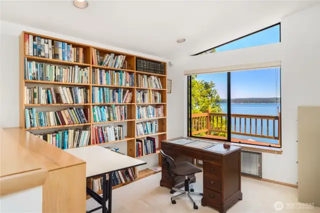 Upper-level library boasts a large window with breathtaking views of Hood Canal and the Olympic Mountains—an inspiring space to read, work, or relax.