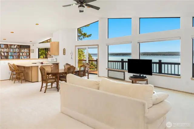 Wall of windows in the upper great room offers stunning, uninterrupted views of Hood Canal and the Olympic Mountains—filling the space with natural light and breathtaking scenery.