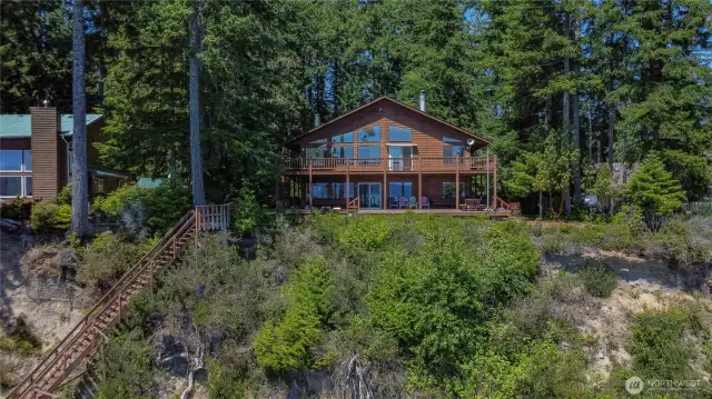 Very large deck with stunning views overlooking 104 feet of pristine waterfront—perfect for relaxing, entertaining, and soaking in the natural beauty.