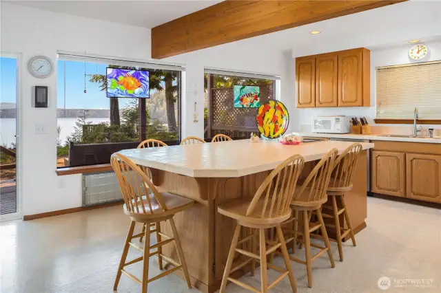 Spacious kitchen features a large island with enough seating for eight—perfect for casual meals, entertaining, and gathering with friends and family.