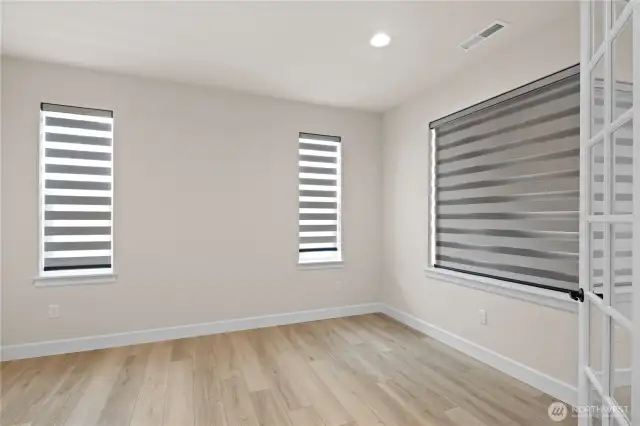 This multi-functional room could be used as an office or den.