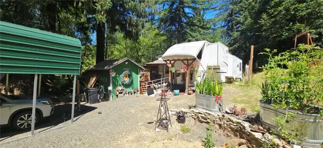 Carport, outbuildings, 5th wheel all come with the property
