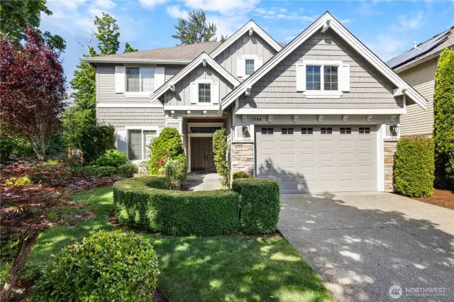 Curb appeal perfected—freshly painted exterior with lush landscaping.