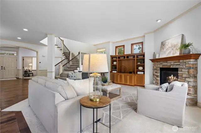Cozy up by the gas fireplace with custom mantle and surrounding built-ins.