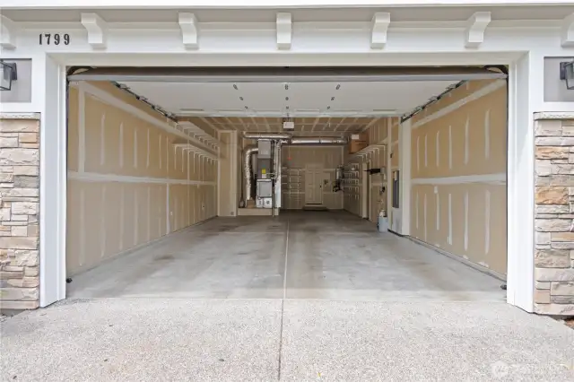 Expansive 3-car tandem garage with plenty of space for cars and gear.