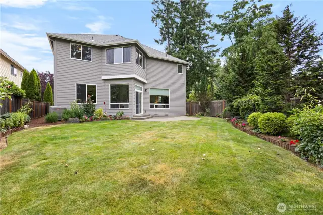 Private backyard retreat with lawn space perfect for relaxing or entertaining.