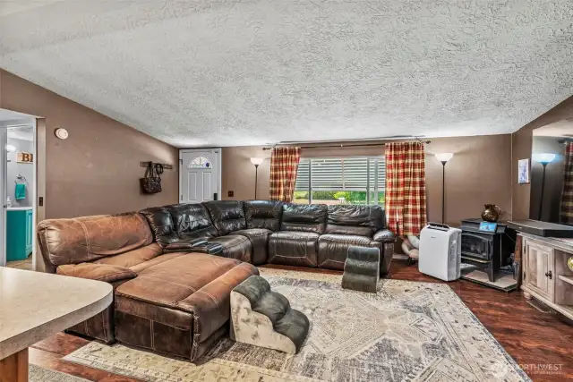 Large living room with full kitchen view