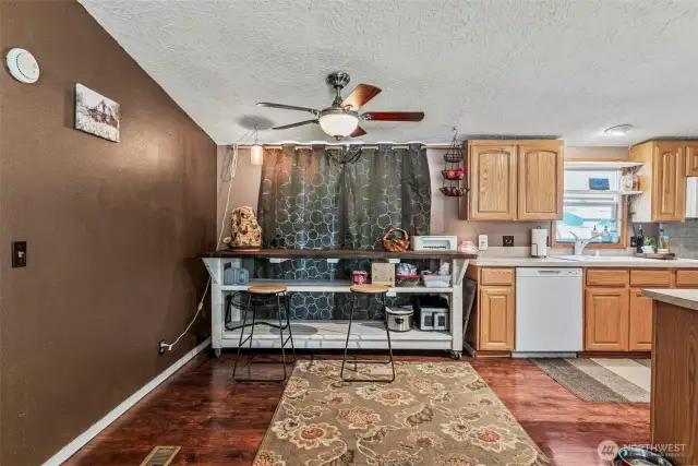 Sliding glass door behind the curtain opens to backyard