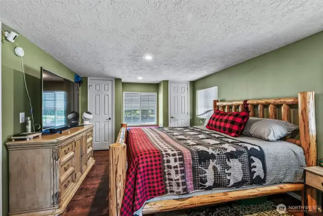 Primary bedroom with his and hers closets