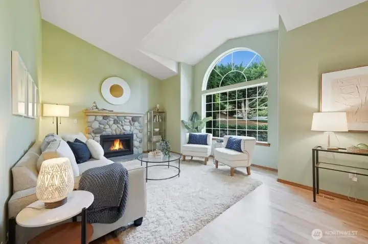 Vaulted Ceilings in Living Room with Gas Fireplace and Picture Window