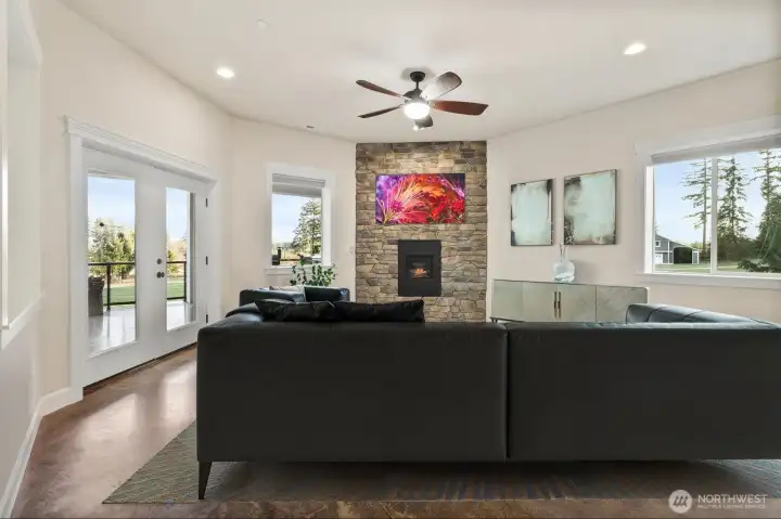 French doors flow onto the expansive integrated concrete terrace.