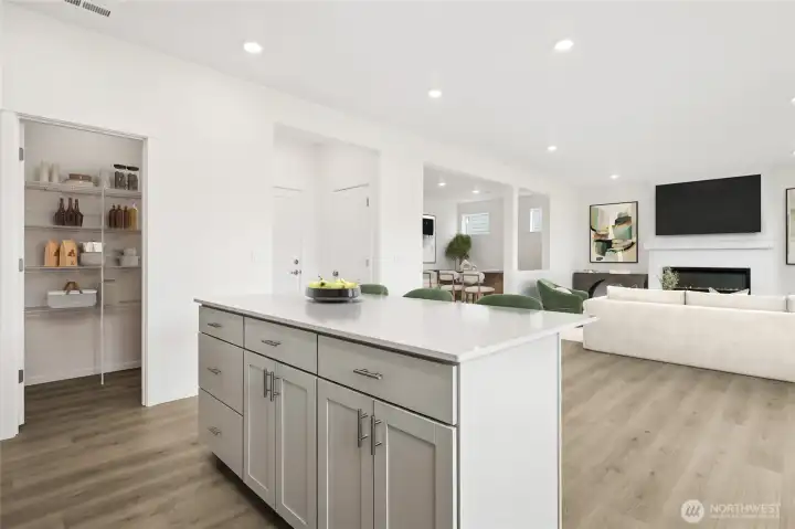 Quartz countertops, soft close cabinets, and walk-in pantry. Virtual Staged.