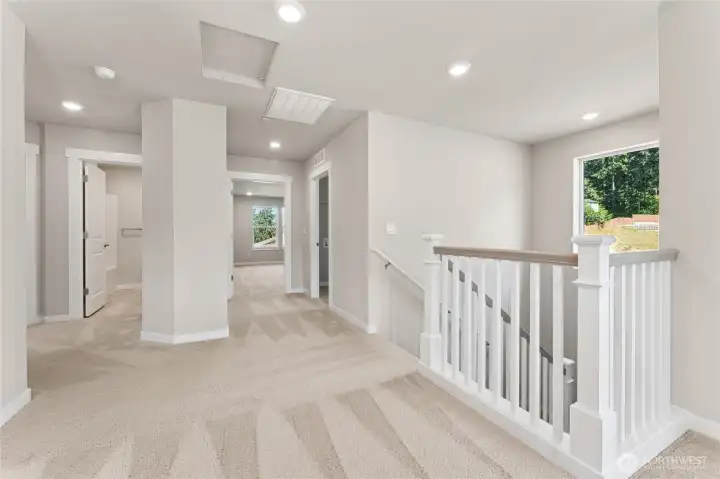 Stairs feature a timeless wooden open railing. Pictures are for representational purposes only, colors and features may vary.