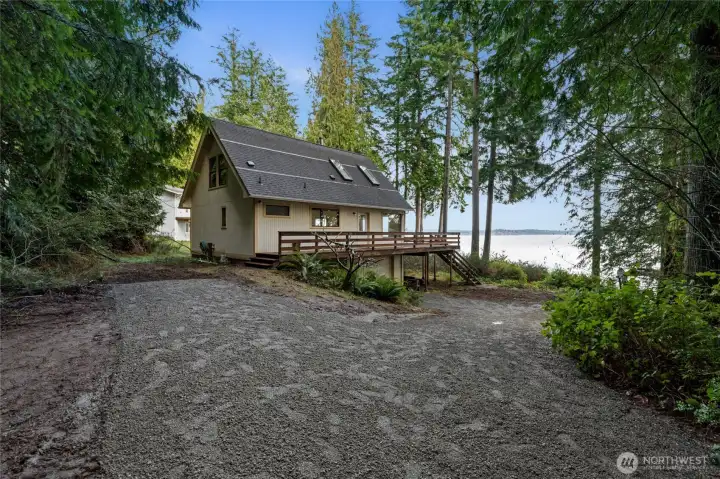 Coming down the main drive. 1 car attached garage plus additional parking behind the home