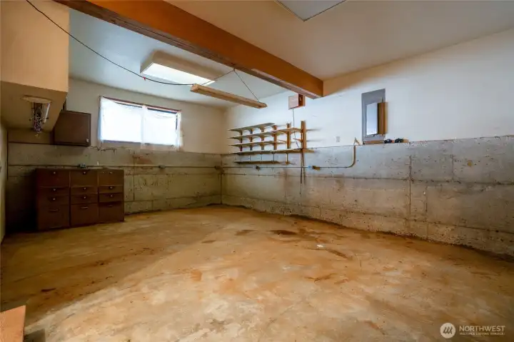 Unfinished space in the ADU. Would be great for a work shop or all of your beach toys.