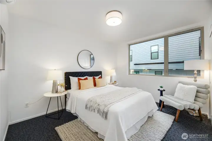 Upper level bedroom with new carpeting. Cozy and dreamy!