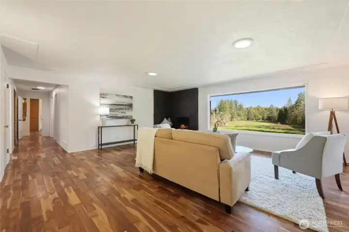 Spacious great room area with extensive hardwood floors throughout