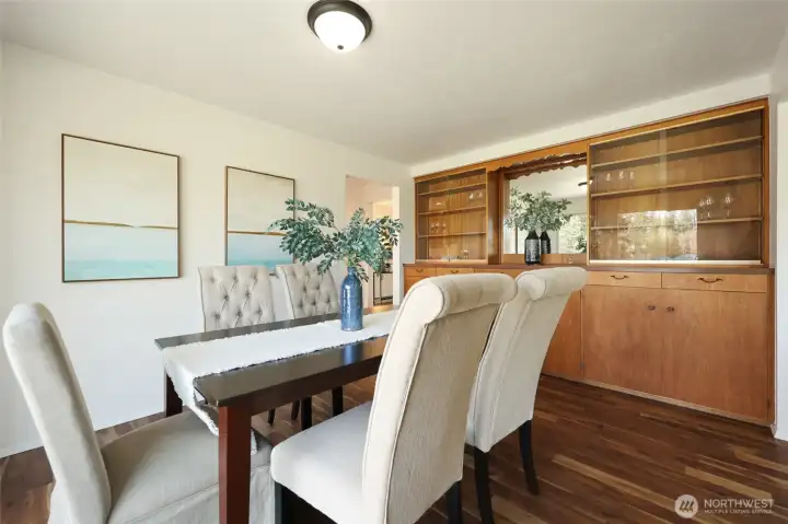 Dining room includes a handsome built in for lots of storage