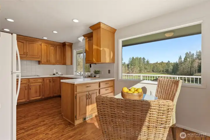 Bright an sunny kitcen nook makes a perfect spot for your morning coffee!