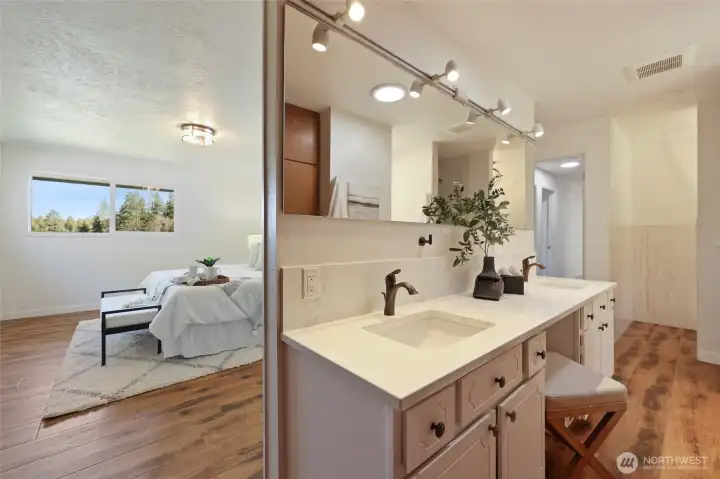 Primary bath has been updated with hard surfaced counters, double sinks, seperate shower and soaking tub, plus tons of built ins!