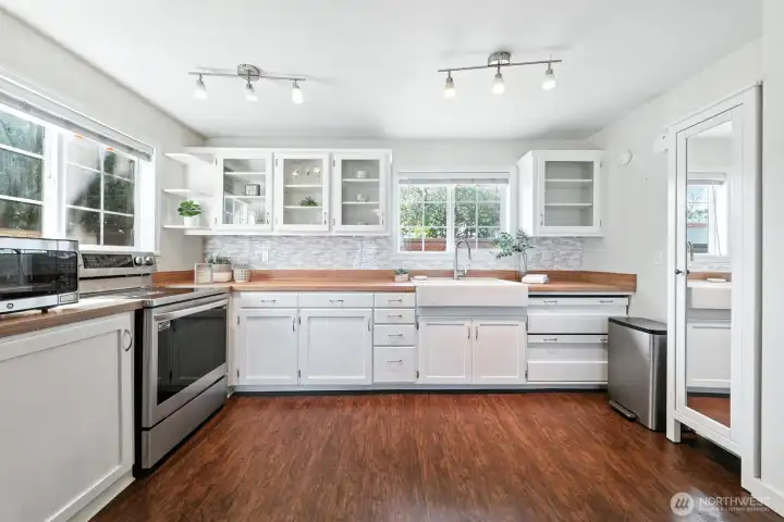 updated kitchen with all updated appliances and backyard garden views