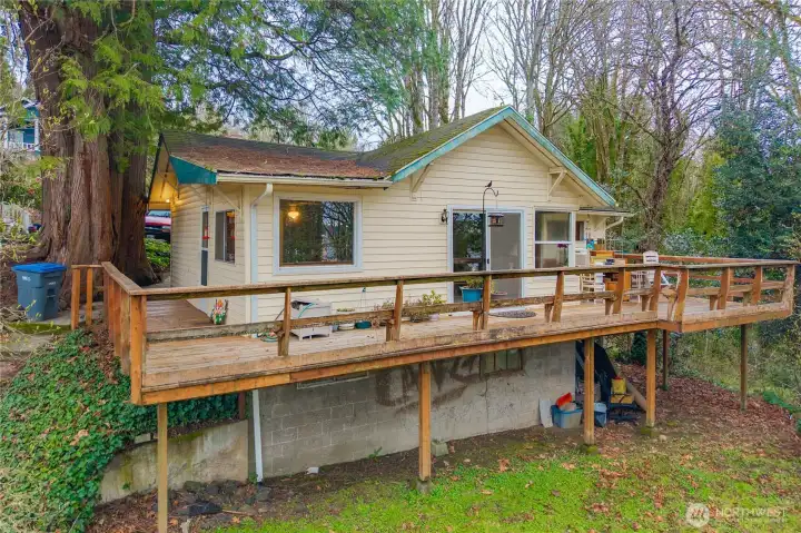 Large wrap-around deck, living room, and dining room have the best views from the home. Two bedrooms and one full bathroom on the main floor, plus it's plumbed for 2nd bath on lower level.