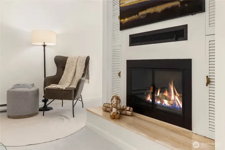 Cozy wood fireplace in the main living area.