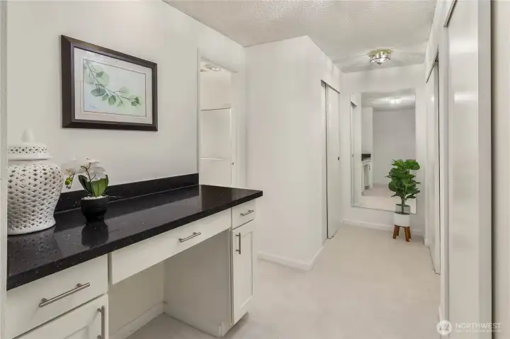 Vanity and closets in primary bedroom suite.