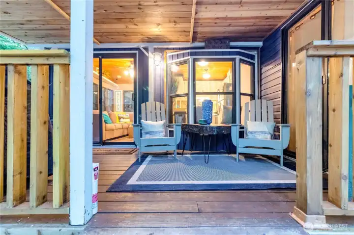 Covered deck seating area with privacy and outdoor lounge space