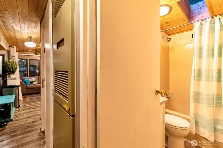 Bathroom entry with tub/shower combo  and vanity