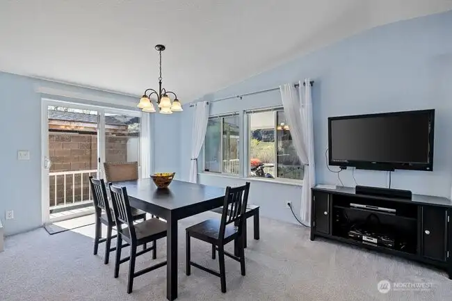 Dining room has sliding door leading to back deck