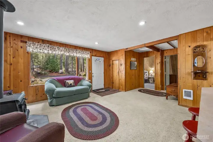 Spacious living room with easy access to bedrooms and flexible layout for relaxing or entertaining.