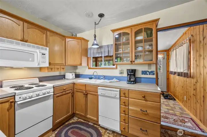 Well-appointed kitchen with plenty of counter space, storage, and natural light