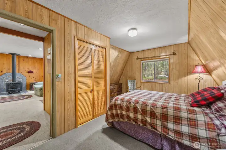 Comfortable bedroom with closet storage and warm cabin charm in the heart of Packwood’s High Valley.