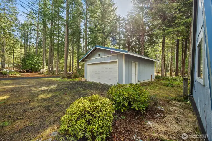 Detached garage/shop with plenty of space for vehicles, gear, or toys—ideal for Packwood outdoor living.