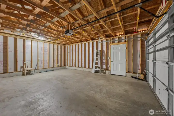 Spacious garage with room for storage, workshop, or recreational equipment—perfect for a Packwood basecamp.