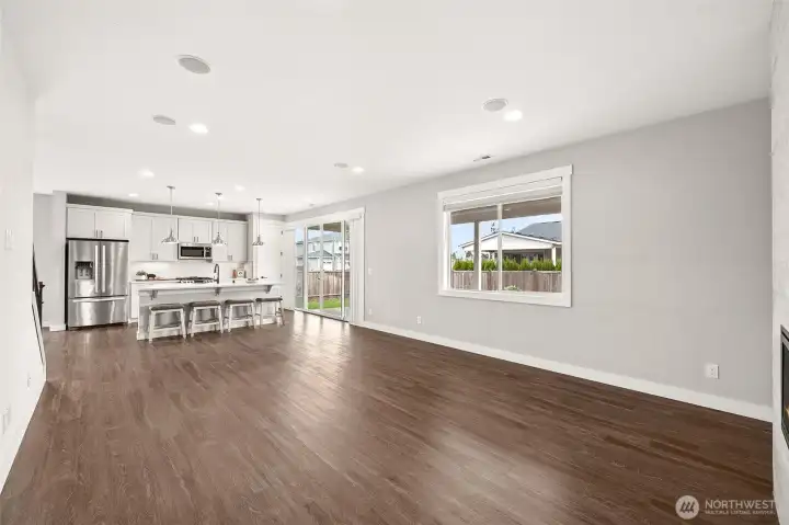 View from your couch into the kitchen and patio area