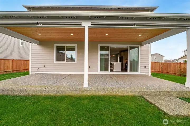 Spacious covered patio with custom sun shades for added privacy & comfort!