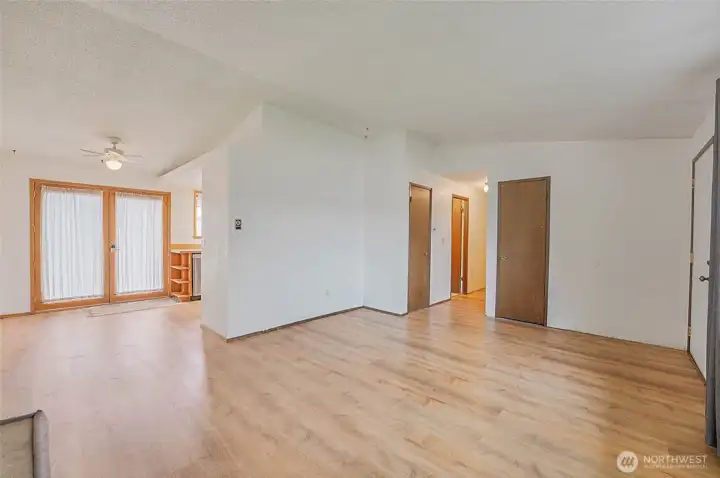 Another living room view with dining area on left.