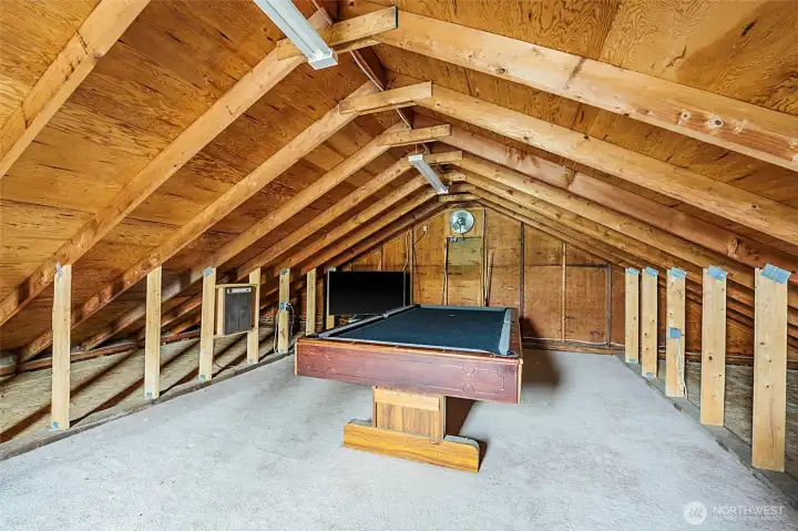 Partially finished heated room above the shop.  Pool table and TV stay.