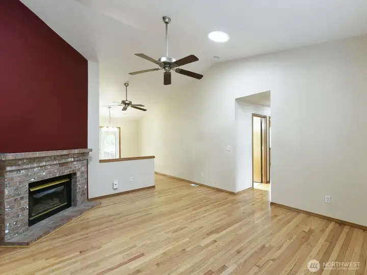 Bright, spacious living room with gas fireplace.