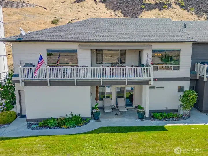 West side w/entertainment sized upper deck w/awning & lower private patio off primary suite.