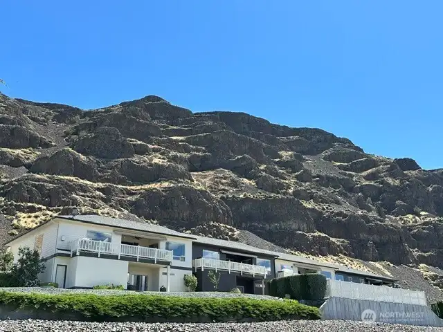 Unique opprtunity! 1 of only 4 units situated at the base of the Basalt Cliffs. Swimming pool shared by 4 families.  180' sweeping Views of the Columbia River/Clockum Mountains/ever changing sunsets and stary nights.