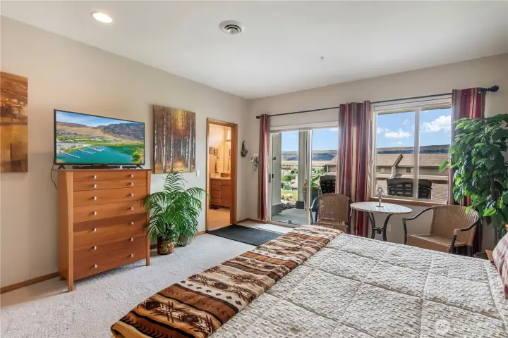 New .tile floors & quartz countertops/backsplash in 2 room spa-like bathroom off Primary retreat.  Room for table & chairs for morning coffee or evening wine down.